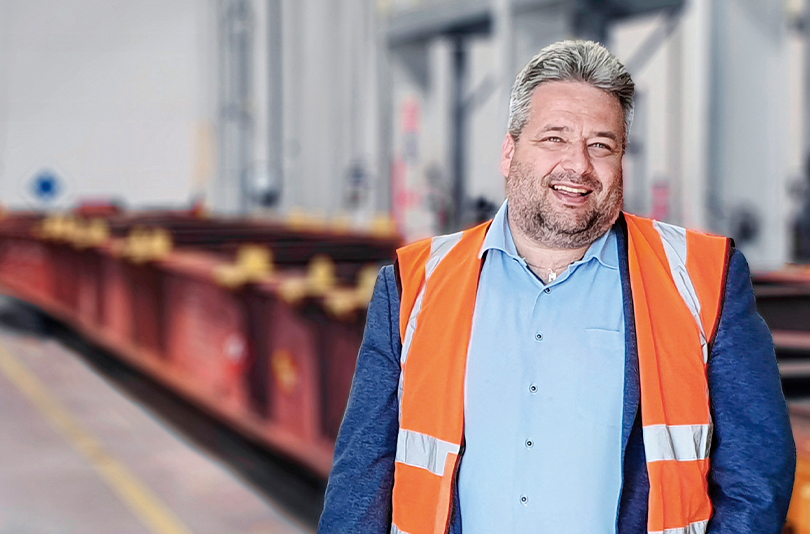 Matej Franc, Head of Rail Operations at Metrans Danubia in Slovakia, stands in front of an unloaded container train. (Photo)